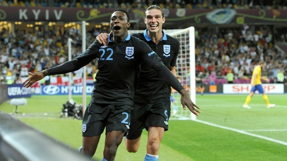 England's Danny Welbeck celebrates with Andy Carroll (right) after scoring the winning goal.