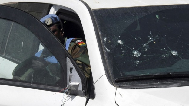 UN observers inspect damaged UN cars upon their return to Damascus, Syria