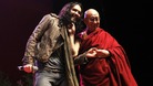 Russell Brand and the Dalai Lama on stage at The Manchester Evening News Arena.