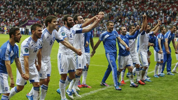 The Greece team celebrate their qualification.