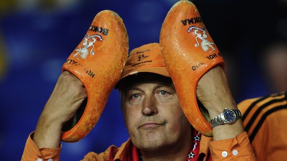 A Dutch fan sits dejected after the Group B defeat to Portugal in Kharkiv.