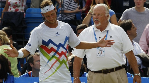 David Nalbandian talks to an ATP official following the incident.