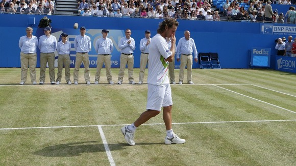 David Nalbandian leaves the court following the incident.