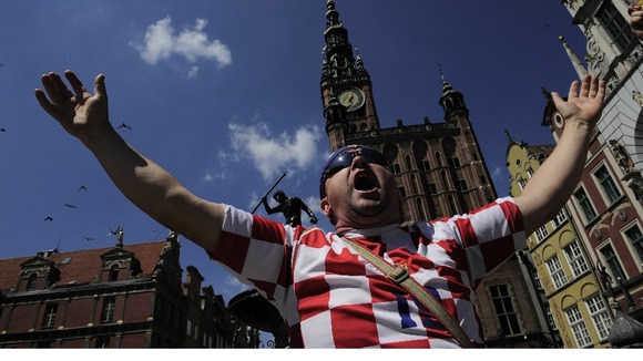 A Croatia fan belts out a tune in Gdansk.