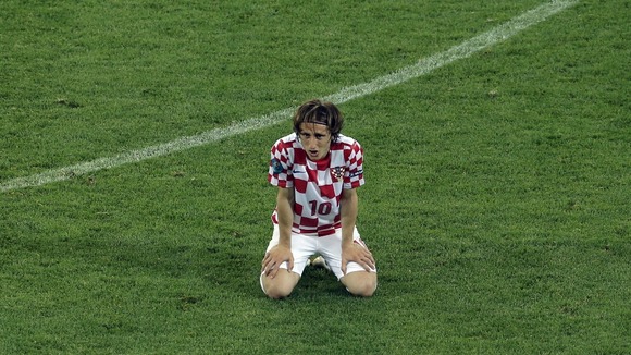Croatia midfielder Luka Modric looks discontent after defeat to Spain.