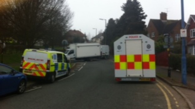 Police remain in Perry Hill road while negotiators try to save 79-year-old woman being held at knife point