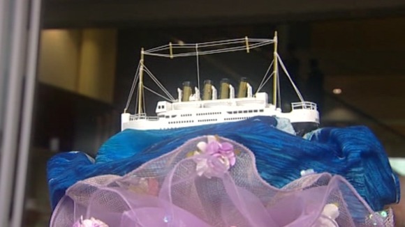 A ship forms the centrepiece of this headwear