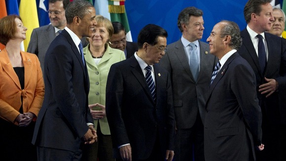 President Barack Obama looks to Mexican President Felipe Calderon