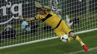 Spain goalkeeper Iker Casillas makes a crucial save from Croatia's Ivan Rakitic.