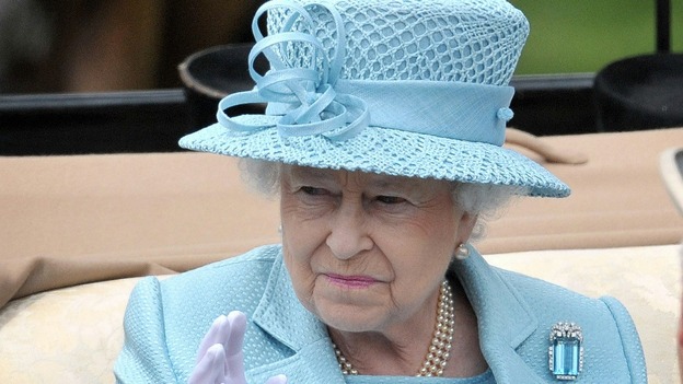 The Queen waves at the crowds as she arrives for the first day of Royal Ascot.