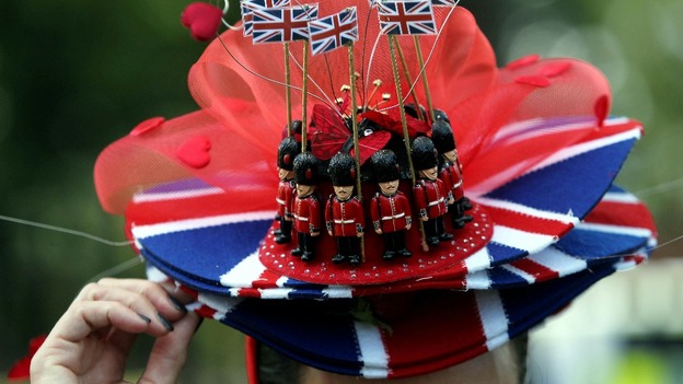 One race-goer wears a hat with the Union flag and toy soldiers on it.