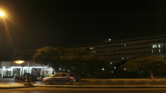 Police officers and military police stand guard outside Maadi military hospital,