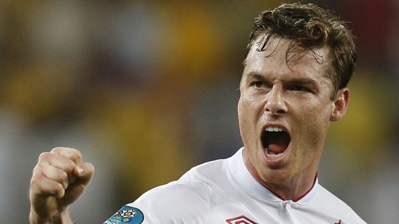 Scott Parker celebrates with England camp and travelling fans after Ukraine win.
