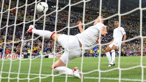 John Terry clears the ball from behind the goal line with Ashley Cole looking on.