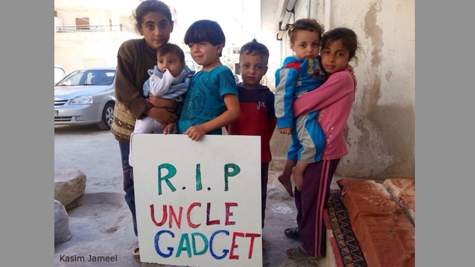 syrian family with banner