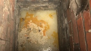 Grease clinging to pipes in a sewExample of grease pulled from a blocked drainer
