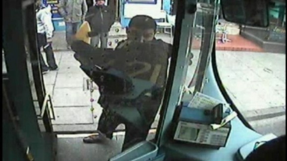 cctv image of a man attacking a bus