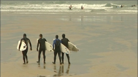 surfers on beach
