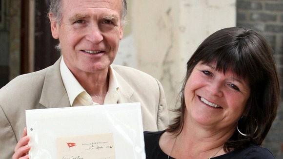 Dr John Martin and Kate Dornan, the niece, of Dr John Simpson hold the letter sent from the Titanic