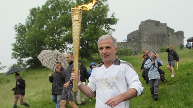 Michael Liptrot carries Olympic Torch