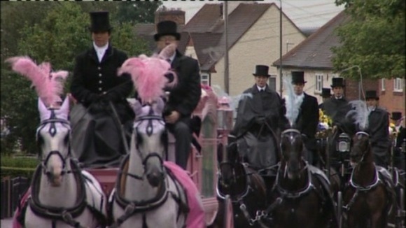 The horse-drawn carriages carried the children's coffins