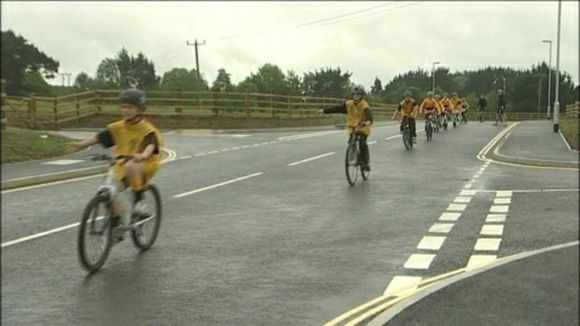 children cycling on Tolvaddon road