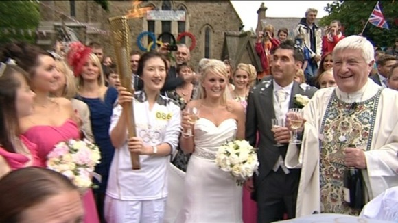 Catherine and Darren - picture with the torch is icing on the cake