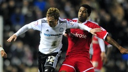 Paul Green faces up against a Reading player at Pride Park
