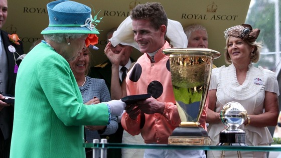 The Queen presents Black Caviar jockey Luke Nolen with the trophy
