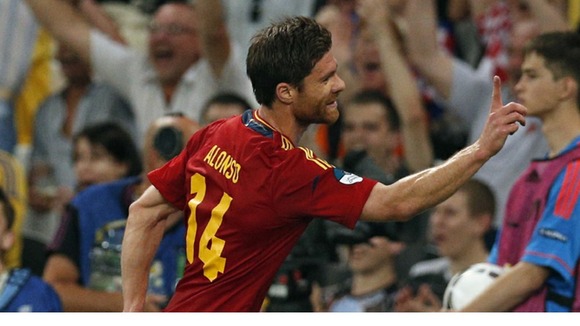 Spain midfielder Xabi Alonso celebrates his first goal.