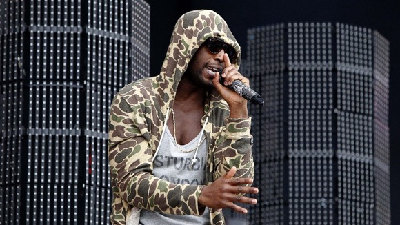 Tinie Tempah performs on the Main Stage at the Isle of Wight Festival.