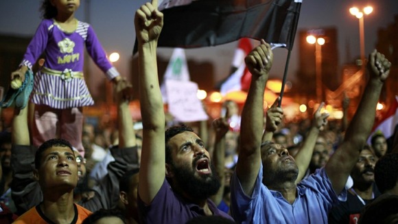 Supporters of the Muslim Brotherhood's presidential candidate Mohamed Morsi shout during a rally against at Tahrir Square