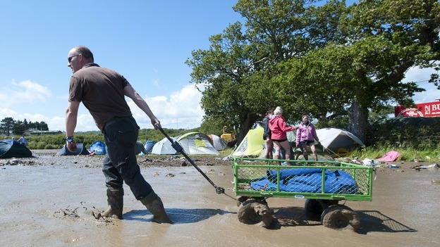 Fans enjoy the festival despite the mud