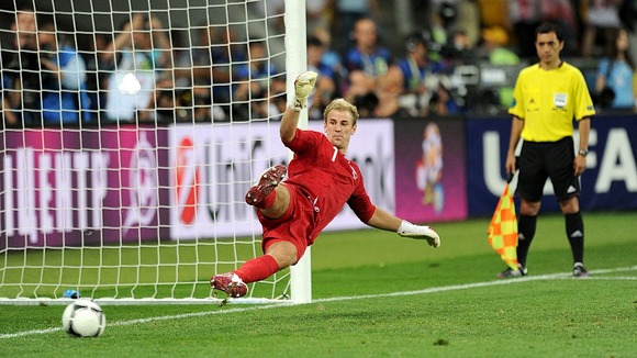 England goalkeeper Joe Hart looks on as a penalty goes in.
