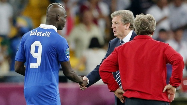 Italy striker Mario Balotellii shakes Roy Hodgson's hand.