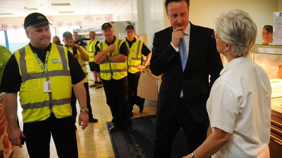 Prime Minister David Cameron meets workers at an Asda Distribution Centre in Dartford, Kent