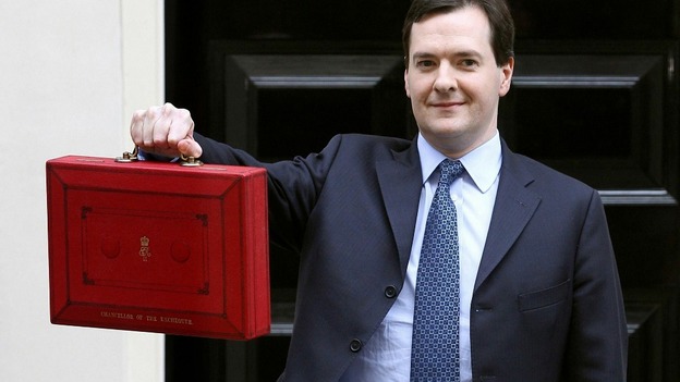 Chancellor of the Exchequer George Osborne holding up his red Ministerial Box outside 11 Downing Street on budget day