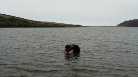Scientist investigating Loe Pool