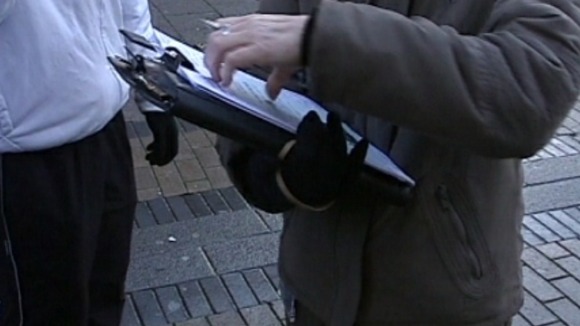 Truancy officer interviewing pupils not in school