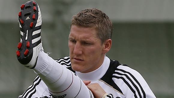 Germany midfielder Bastian Schweinsteiger stretches during training in Gdansk.