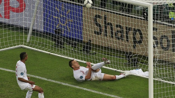 England defender John Terry clears the ball against Ukraine.