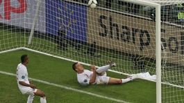 England defender John Terry clears the ball against Ukraine.