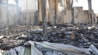  Debris from damaged buildings is seen after gunmen stormed the headquarters of Al-Ikhbariya news channel near Damascus.