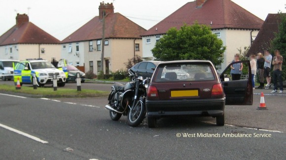 Police at scene of motorcycle-car collision in Norton, Worcestershire