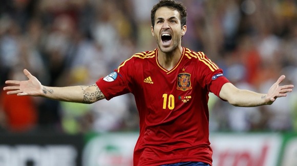 Spain midfielder Cesc Fabregas celebrates his winning penalty.