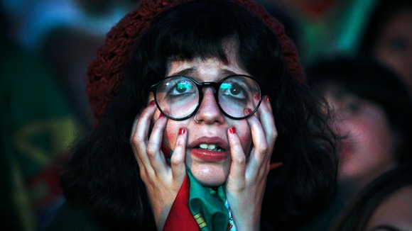A Portugal fan reacts to losing in Lisbon.