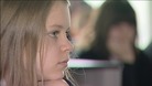 Pupil listens to trainee teacher          