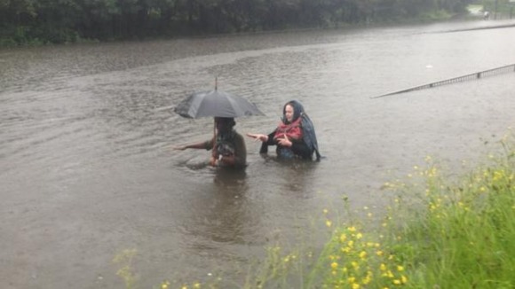 People trying to get home through the Newcastle floods