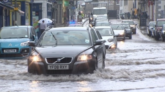 Drivers struggle through flood water in Kendal