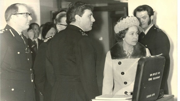PC Michael Teague (right) meeting Queen Elizabeth II during her visit to New Scotland Yard.
